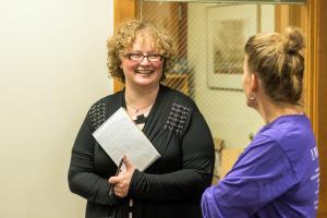Two people chatting and smiling